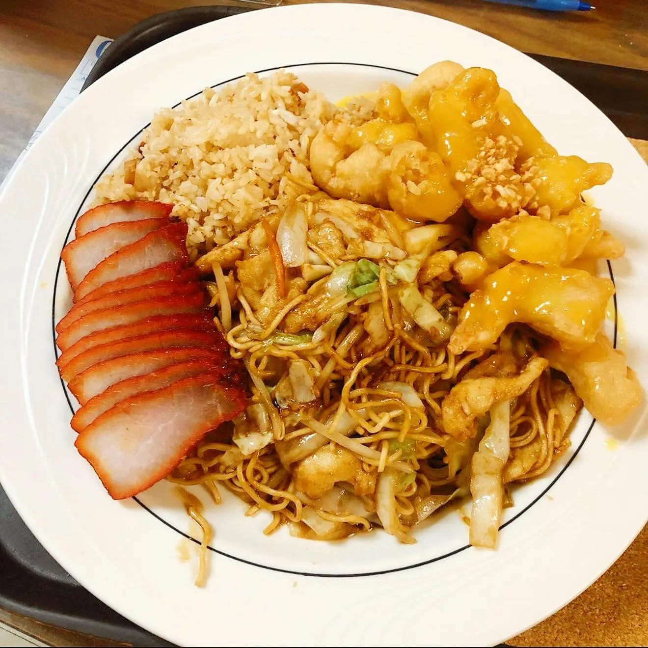 Combo platter with rice, noodles, BBQ pork and sweet - and - sour chicken at Ocean Sky, a Chinese Restaurant in Chehalis