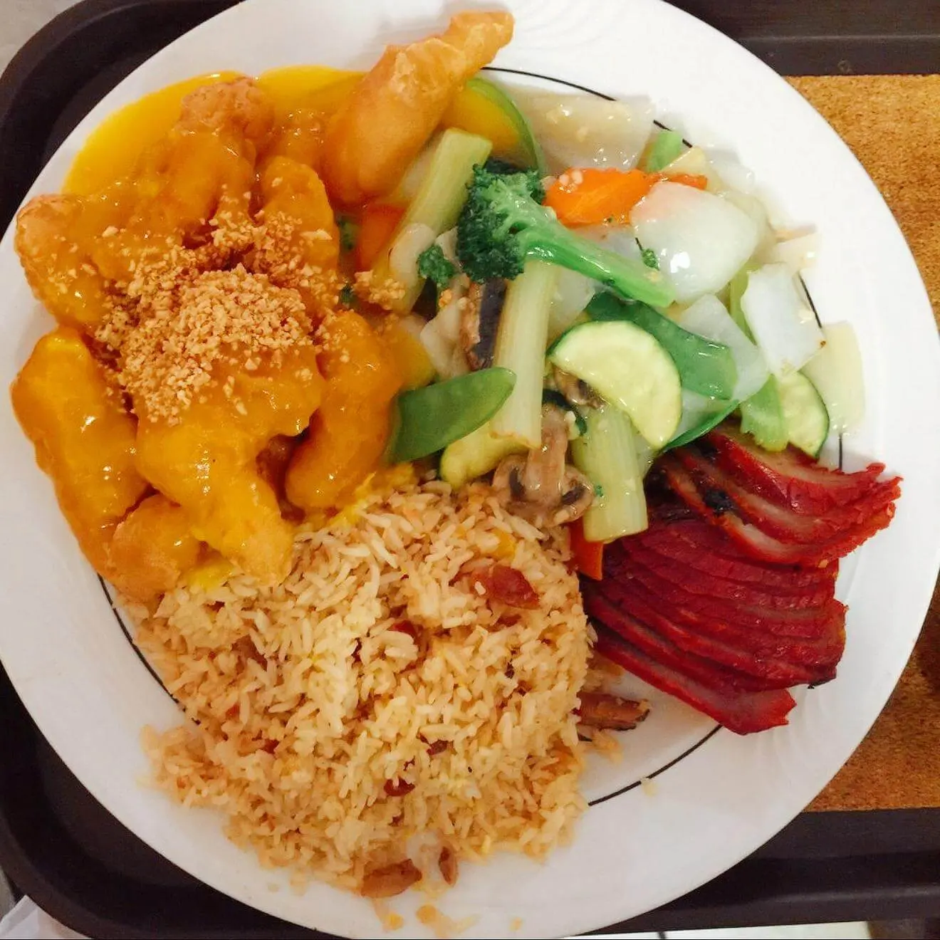 Combo plate with sweet and sour chicken, fried rice, BBQ pork and veggies at Ocean Sky, a Chinese Restaurant in Chehalis